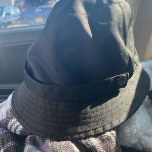 Authentic Burberry womans black bucket hat medium. Nova check lining.